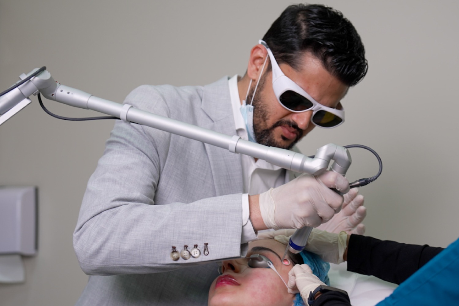 Patient receiving laser skin procedure at Reveal Clinics Riyadh