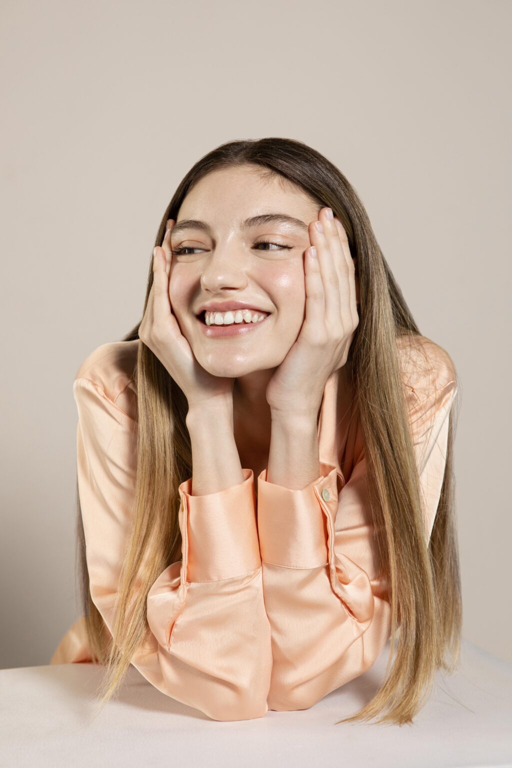 Woman smiling with radiant skin after a personalized facial