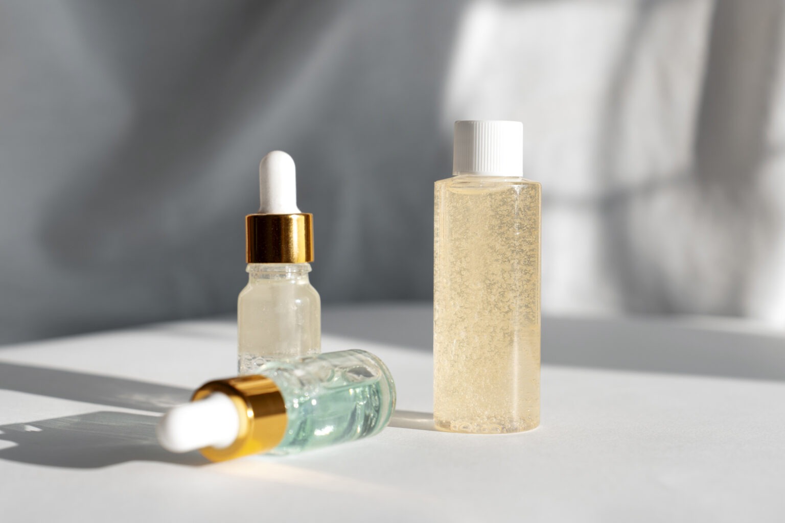 Serums and skincare products used for hydration and antioxidant glow infusion at Reveal Clinics Riyadh.