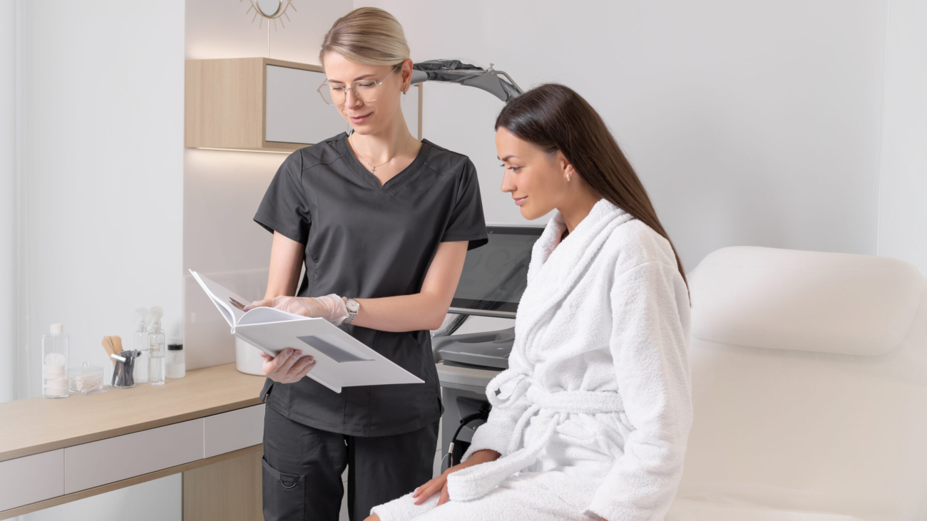 An aesthetician consulting a patient for scalp aesthetics and hair rejuvenation at Reveal Clinics Riyadh.