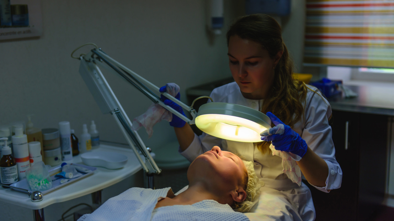 Close-up of a brightening laser session (generic PicoWay or Fraxel handpiece).