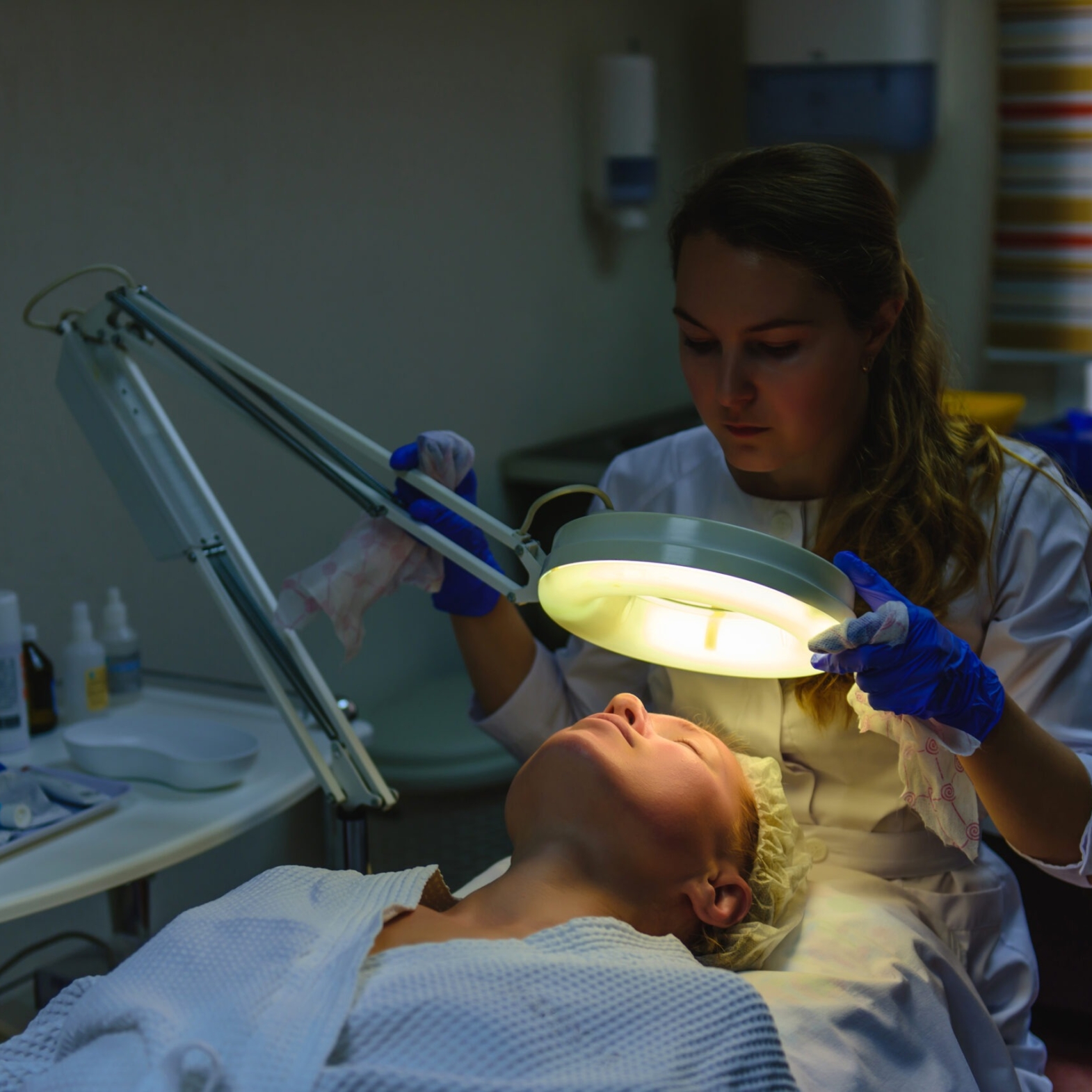 Close-up of a brightening laser session (generic PicoWay or Fraxel handpiece).