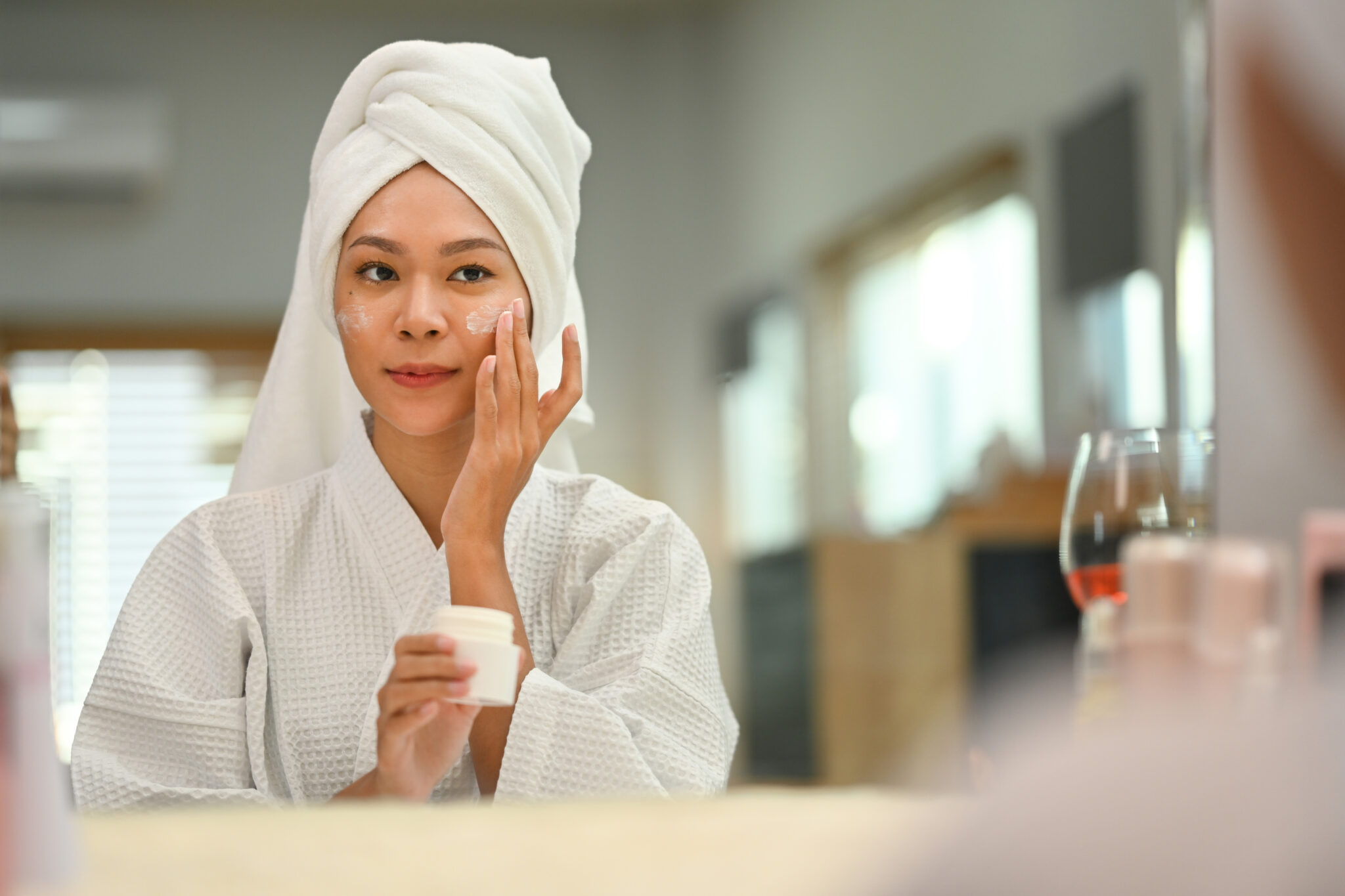 Applying moisturizer to damp skin for better hydration retention